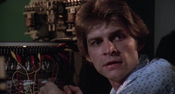 Movie still from “The China Syndrome” (1979), directed by James Bridges – A young man is looking at the camera; Close Up shot, Low angle