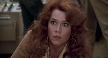 Movie still from “The China Syndrome” (1979), directed by James Bridges – A person with long red hair; Close Up shot, Over the shoulder angle