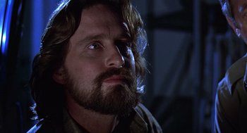 Movie still from “The China Syndrome” (1979), directed by James Bridges – A person with long hair and a beard; Close Up shot, Low angle