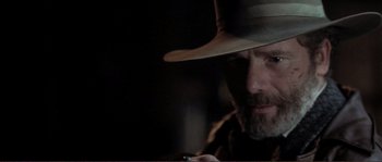 Movie still from “The Claim” (2000), directed by Michael Winterbottom – A person wearing a hat; Close Up shot, Low angle