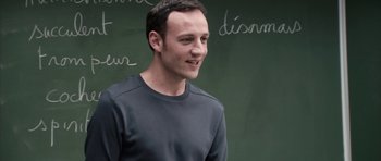 Movie still from “The Class” (2008), directed by Laurent Cantet – A man standing in front of a chalkboard; Close Up shot, Over the shoulder angle