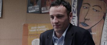 Movie still from “The Class” (2008), directed by Laurent Cantet – A person wearing a suit and tie; Close Up shot, Over the shoulder angle