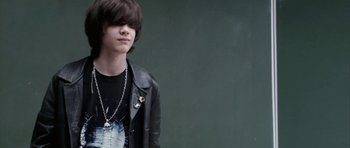 Movie still from “The Class” (2008), directed by Laurent Cantet – A young man wearing a black leather jacket; Close Up shot, Over the shoulder angle