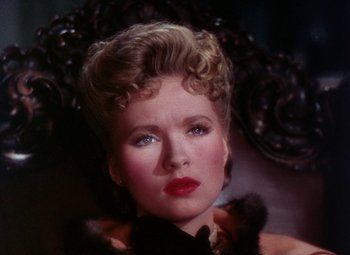 Movie still from “The Climax” (1944), directed by George Waggner – A person wearing a dress; Close Up shot, High angle