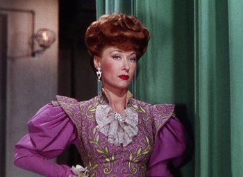Movie still from “The Climax” (1944), directed by George Waggner – A person wearing a dress; Close Up shot, Over the shoulder angle
