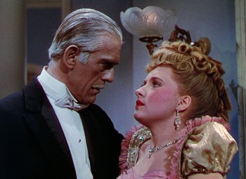 Movie still from “The Climax” (1944), directed by George Waggner – An older man and a young woman dressed in formal wear; Close Up shot, Low angle