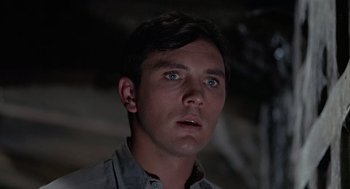 Movie still from “The Collector” (1965), directed by William Wyler – A person looking up at the sky; Close Up shot, Low angle