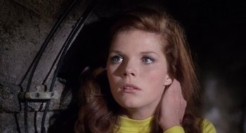 Movie still from “The Collector” (1965), directed by William Wyler – A woman with her hand on her head; Close Up shot, Low angle