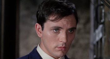 Movie still from “The Collector” (1965), directed by William Wyler – A person wearing a suit and tie; Close Up shot, High angle