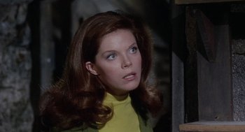 Movie still from “The Collector” (1965), directed by William Wyler – A person with long brown hair; Close Up shot, High angle