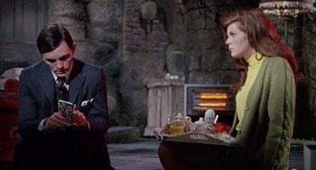 Movie still from “The Collector” (1965), directed by William Wyler – A man and a woman sitting next to each other; Medium shot, Over the shoulder angle