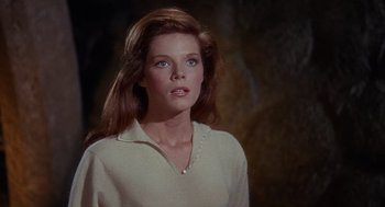 Movie still from “The Collector” (1965), directed by William Wyler – A woman in a white shirt is looking at the camera; Close Up shot, High angle