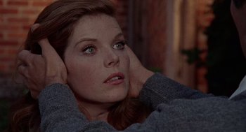 Movie still from “The Collector” (1965), directed by William Wyler – A person with her hands behind her head; Close Up shot, High angle