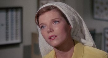 Movie still from “The Collector” (1965), directed by William Wyler – A person with a towel on their head; Close Up shot, Low angle