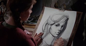 Movie still from “The Collector” (1965), directed by William Wyler – A woman drawing a picture of a woman's face; Close Up shot, Over the shoulder angle