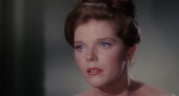 Movie still from “The Collector” (1965), directed by William Wyler – A person wearing a dress; Close Up shot, Over the shoulder angle