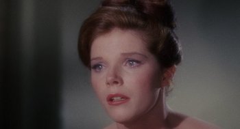 Movie still from “The Collector” (1965), directed by William Wyler – A person wearing a dress; Close Up shot, Over the shoulder angle