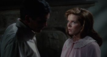 Movie still from “The Collector” (1965), directed by William Wyler – A man and a woman standing next to each other; Close Up shot, Over the shoulder angle