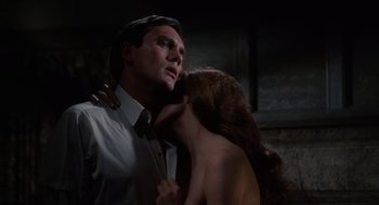 Movie still from “The Collector” (1965), directed by William Wyler – A man and a woman kissing in a dark room; Close Up shot, Low angle