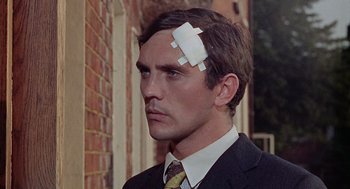 Movie still from “The Collector” (1965), directed by William Wyler – A man in a business suit with a piece of paper stuck to his head; Close Up shot, Low angle