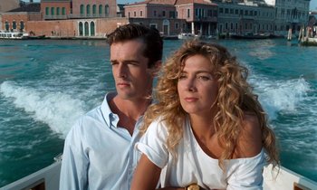 Movie still from “The Comfort of Strangers” (1990), directed by Paul Schrader – A man and a woman standing next to each other on a boat; Medium shot, Low angle