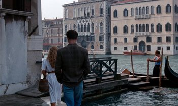 Movie still from “The Comfort of Strangers” (1990), directed by Paul Schrader – A man and a woman walking on a pier; Wide shot, High angle