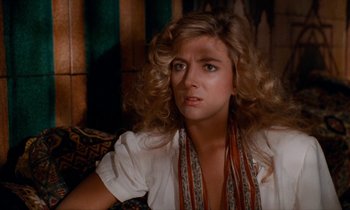 Movie still from “The Comfort of Strangers” (1990), directed by Paul Schrader – A person wearing a white shirt; Close Up shot, Over the shoulder angle