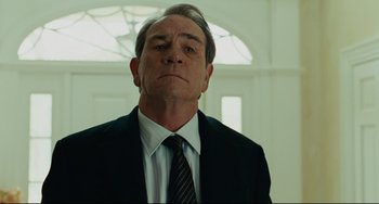 Movie still from “The Company Men” (2010), directed by John Wells – An older man in a suit and tie; Close Up shot, Low angle