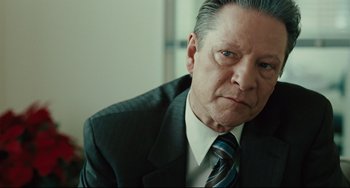 Movie still from “The Company Men” (2010), directed by John Wells – An older man in a suit and a tie; Close Up shot, Low angle