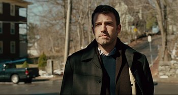 Movie still from “The Company Men” (2010), directed by John Wells – A person wearing a coat; Medium shot, Over the shoulder angle