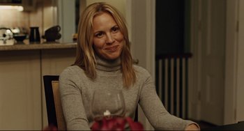Movie still from “The Company Men” (2010), directed by John Wells – A woman sitting in front of a wine glass; Close Up shot, Over the shoulder angle