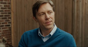 Movie still from “The Company Men” (2010), directed by John Wells – A person wearing a blue sweater; Close Up shot, Over the shoulder angle