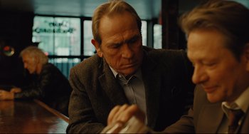 Movie still from “The Company Men” (2010), directed by John Wells – An older man sitting at a table in front of a woman; Close Up shot, Over the shoulder angle