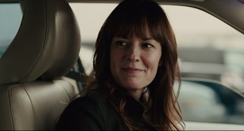 Movie still from “The Company Men” (2010), directed by John Wells – A person sitting in a car; Close Up shot, Over the shoulder angle