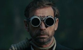 Movie still from “The Confession” (1970), directed by Costa-Gavras – A person wearing goggles; Close Up shot, Low angle