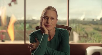 Movie still from “The Congress” (2013), directed by Ari Folman – A woman sitting in a chair with her hand under her chin; Close Up shot, Low angle