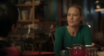 Movie still from “The Congress” (2013), directed by Ari Folman – A woman sitting at a table in front of a coffee pot; Close Up shot, Over the shoulder angle