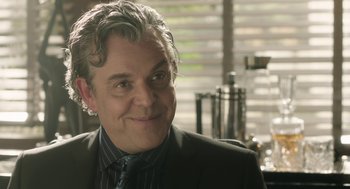 Movie still from “The Congress” (2013), directed by Ari Folman – A person wearing a suit and tie; Close Up shot, Over the shoulder angle