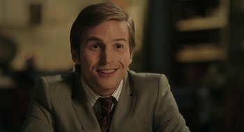 Movie still from “The Congress” (2013), directed by Ari Folman – A person wearing a suit and tie; Close Up shot, Over the shoulder angle