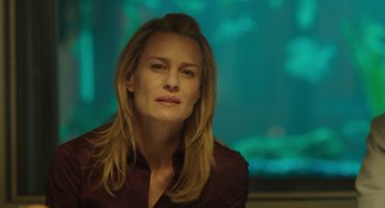 Movie still from “The Congress” (2013), directed by Ari Folman – A woman with long blonde hair sitting in front of a green screen; Close Up shot, Over the shoulder angle