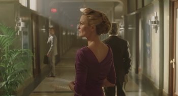 Movie still from “The Congress” (2013), directed by Ari Folman – A woman in a purple dress standing next to a wall; Medium shot, Low angle