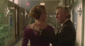 Movie still from “The Congress” (2013), directed by Ari Folman – A man and a woman are standing together in a hallway; Medium shot, Low angle