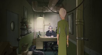 Movie still from “The Congress” (2013), directed by Ari Folman – An old man sitting at a desk in front of an older woman; Wide shot, High angle