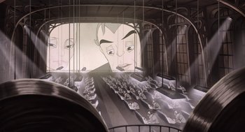 Movie still from “The Congress” (2013), directed by Ari Folman – A large painting of a man's face on a wall; Extreme Wide shot, High angle