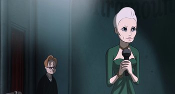 Movie still from “The Congress” (2013), directed by Ari Folman – An old woman is holding a microphone while a man looks on; Medium shot, Over the shoulder angle