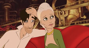 Movie still from “The Congress” (2013), directed by Ari Folman – An animated man and woman sitting next to each other on a couch; Close Up shot, High angle