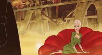 Movie still from “The Congress” (2013), directed by Ari Folman – A woman sitting on top of a red couch; Wide shot, High angle