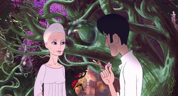 Movie still from “The Congress” (2013), directed by Ari Folman – A man and a woman are standing next to each other in front of a forest; Medium shot, Over the shoulder angle