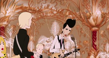 Movie still from “The Congress” (2013), directed by Ari Folman – A man is playing a guitar in front of two other people; Medium shot, Over the shoulder angle