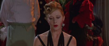 Movie still from “The Cook, the Thief, His Wife & Her Lover” (1989), directed by Peter Greenaway – A person wearing a dress; Close Up shot, Low angle